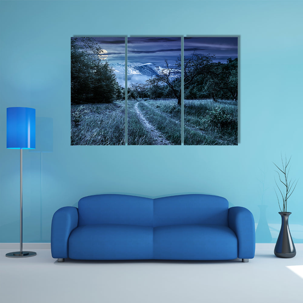 Curved Roads In A Rural Valley Crossing The Mountains With Snowy Peak In A Winter Landscape, Multi Panel Canvas Wall Art
