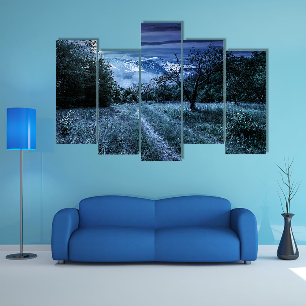 Curved Roads In A Rural Valley Crossing The Mountains With Snowy Peak In A Winter Landscape, Multi Panel Canvas Wall Art