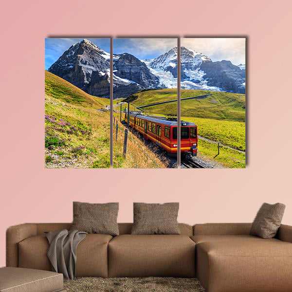 Famous electric red tourist train coming down from Jungfraujoch station art