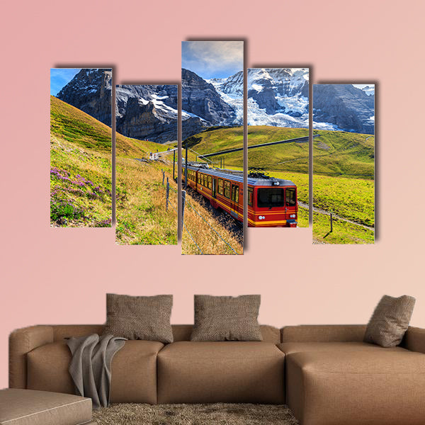 Famous electric red tourist train coming down from Jungfraujoch station art