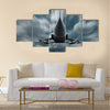 Military airplane at flying on the speed multi panel canvas wall art