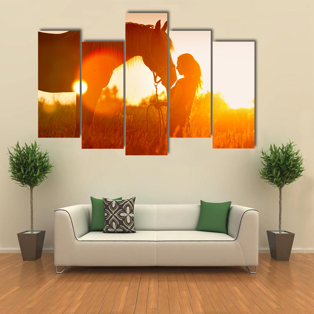 Beautiful silhouette of girl and horse at sunset multi panel canvas wall art