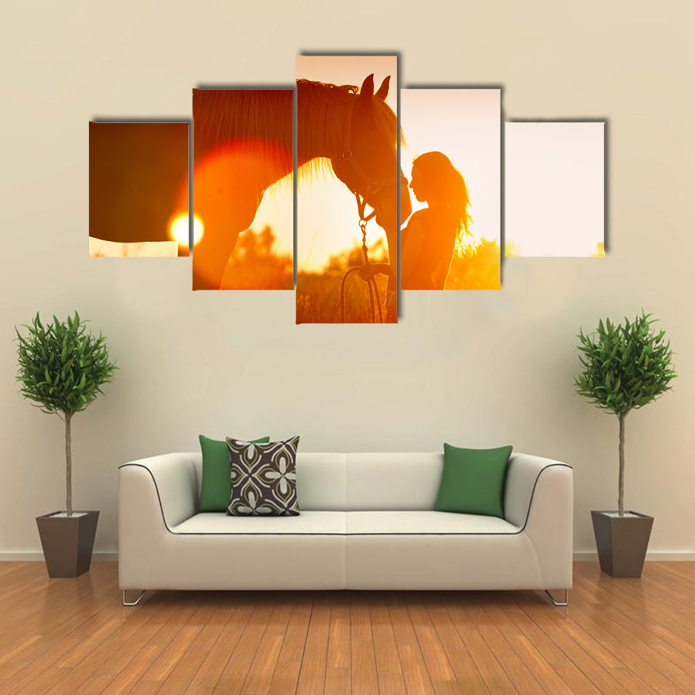 Beautiful silhouette of girl and horse at sunset multi panel canvas wall art