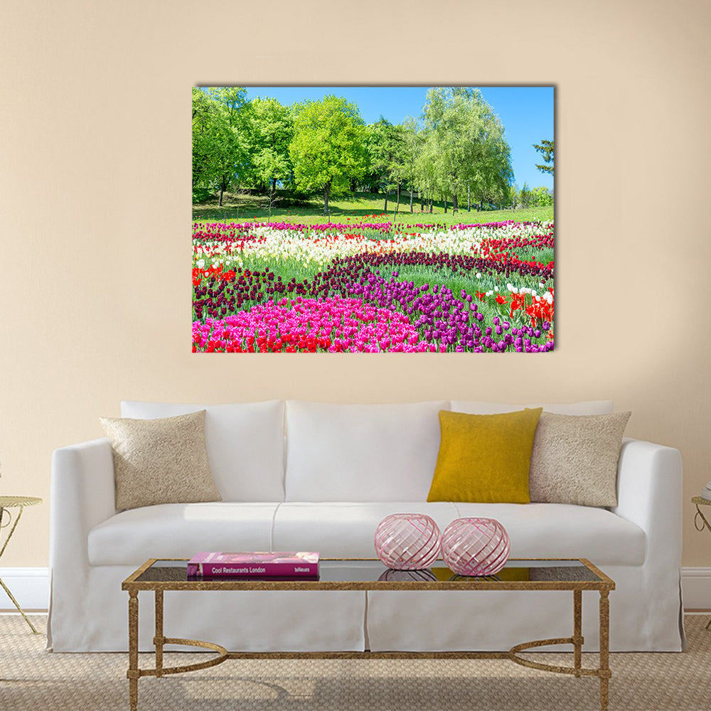 Field of tulips with many colorful flowers in the green park Multi Panel Canvas Wall Art