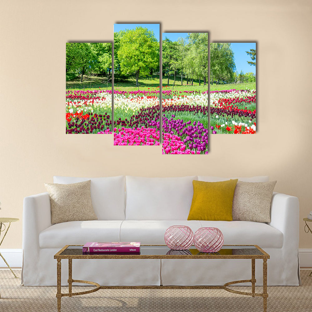 Field of tulips with many colorful flowers in the green park Multi Panel Canvas Wall Art