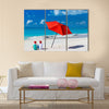 Kids in red Santa hats having fun at tropical beach during Christmas vacation Multi panel canvas wall art