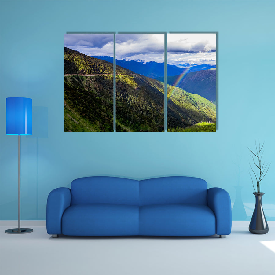 mountain landscape pine trees hillside under blue sky with clouds and rainbow multi panel canvas wall art