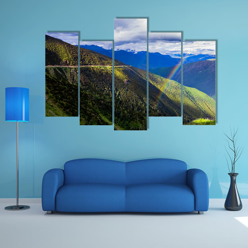 mountain landscape pine trees hillside under blue sky with clouds and rainbow multi panel canvas wall art