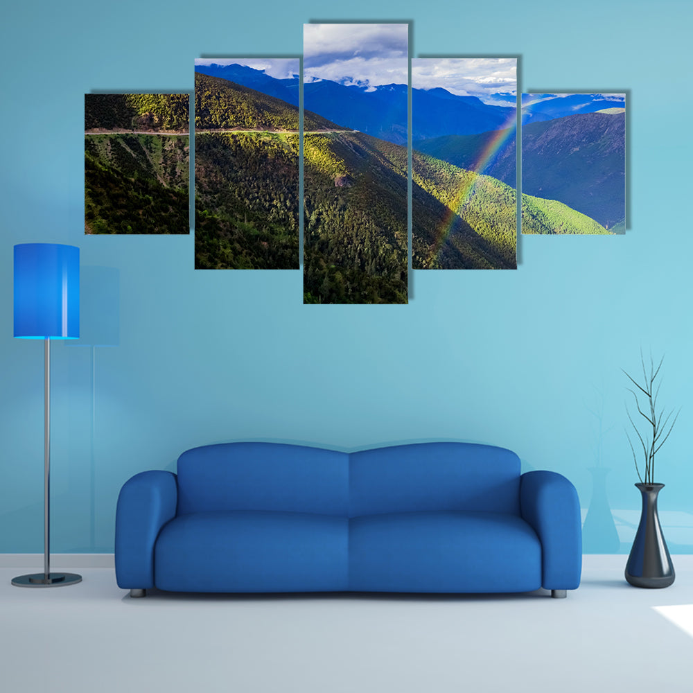 mountain landscape pine trees hillside under blue sky with clouds and rainbow multi panel canvas wall art
