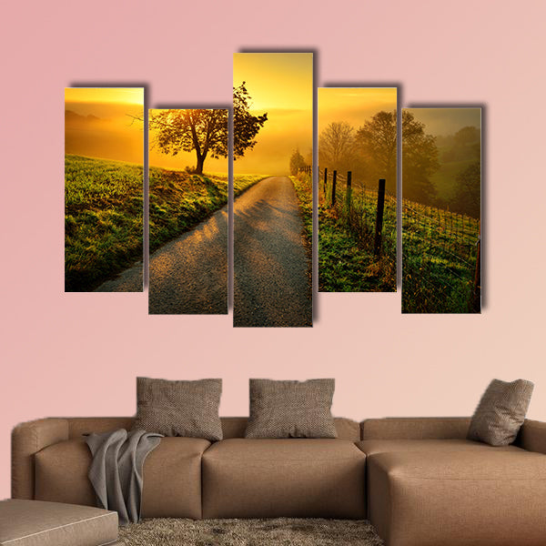 Rural landscape on a hill with a tree on a meadow at sunrise, canvas wall art