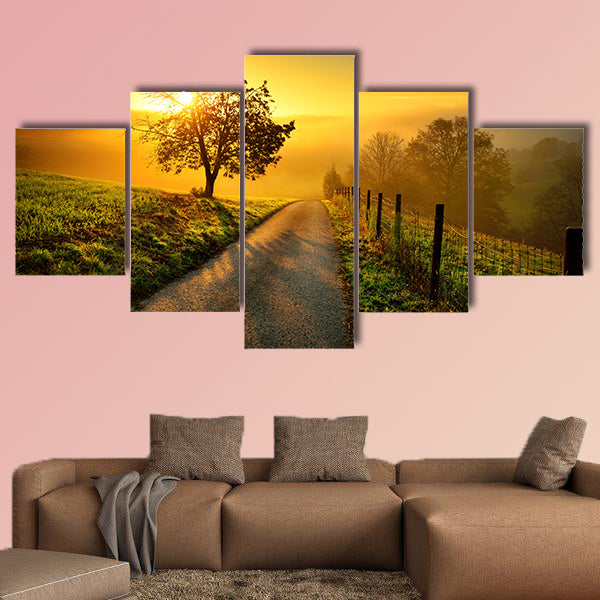 Rural landscape on a hill with a tree on a meadow at sunrise, canvas wall art