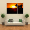 Silhouette Of A Akita Inu Dog At Golden Sunset. Multi Panel Canvas Wall Art