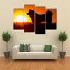 Silhouette Of A Akita Inu Dog At Golden Sunset. Multi Panel Canvas Wall Art