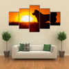 Silhouette Of A Akita Inu Dog At Golden Sunset. Multi Panel Canvas Wall Art