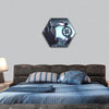 Robotic hand holding a gear hexagonal canvas wall art