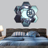 Robotic hand holding a gear hexagonal canvas wall art