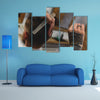 Barber Holding and Cutting hair of a Client, Hair Care Concept Multi Panel Canvas Wall Art