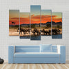 Herd of elephants in african savanna at sunset Multi panel canvas wall art