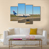 airplane at LaGuardia Airport multi panel canvas wall art