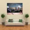 volleyball players in action on the open air court Multi panel canvas wall art