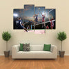 volleyball players in action on the open air court Multi panel canvas wall art