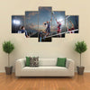 volleyball players in action on the open air court Multi panel canvas wall art