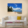 Young woman in bikini standing on the beach of Makaha'a island in Tonga Multi panel canvas wall art