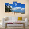 Young woman in bikini standing on the beach of Makaha'a island in Tonga Multi panel canvas wall art