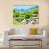 Bridge and stream in Valbona valley with Albanian Alps background Multi Panel Canvas Wall Art