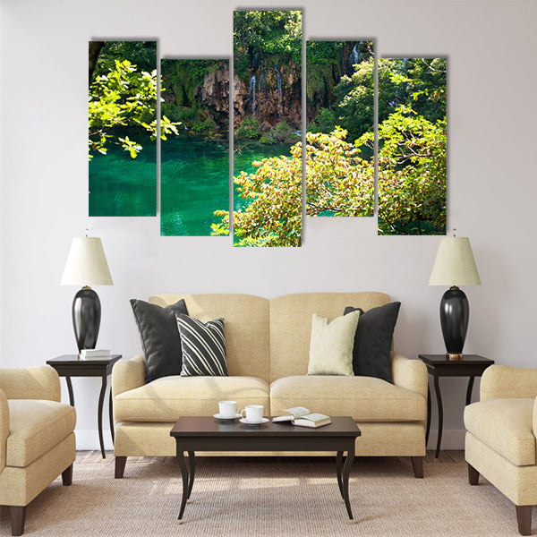 Lake with transparent emerald water multi panel canvas wall art