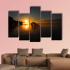 Lake Chicot is bathed in golden sunrise multi panel canvas wall art