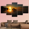 Lake Chicot is bathed in golden sunrise multi panel canvas wall art