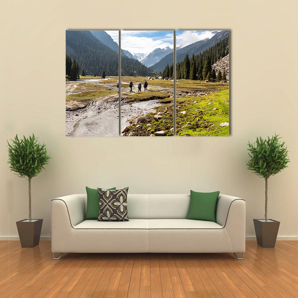 A Group Of Hikers Climbing On The Tein Shan Mountains In Kyrgyzstan Multi Panel Canvas Wall Art