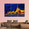 Snowy winter scene of a cabin in distance at night multi panel canvas wall art