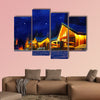 Snowy winter scene of a cabin in distance at night multi panel canvas wall art