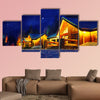 Snowy winter scene of a cabin in distance at night multi panel canvas wall art