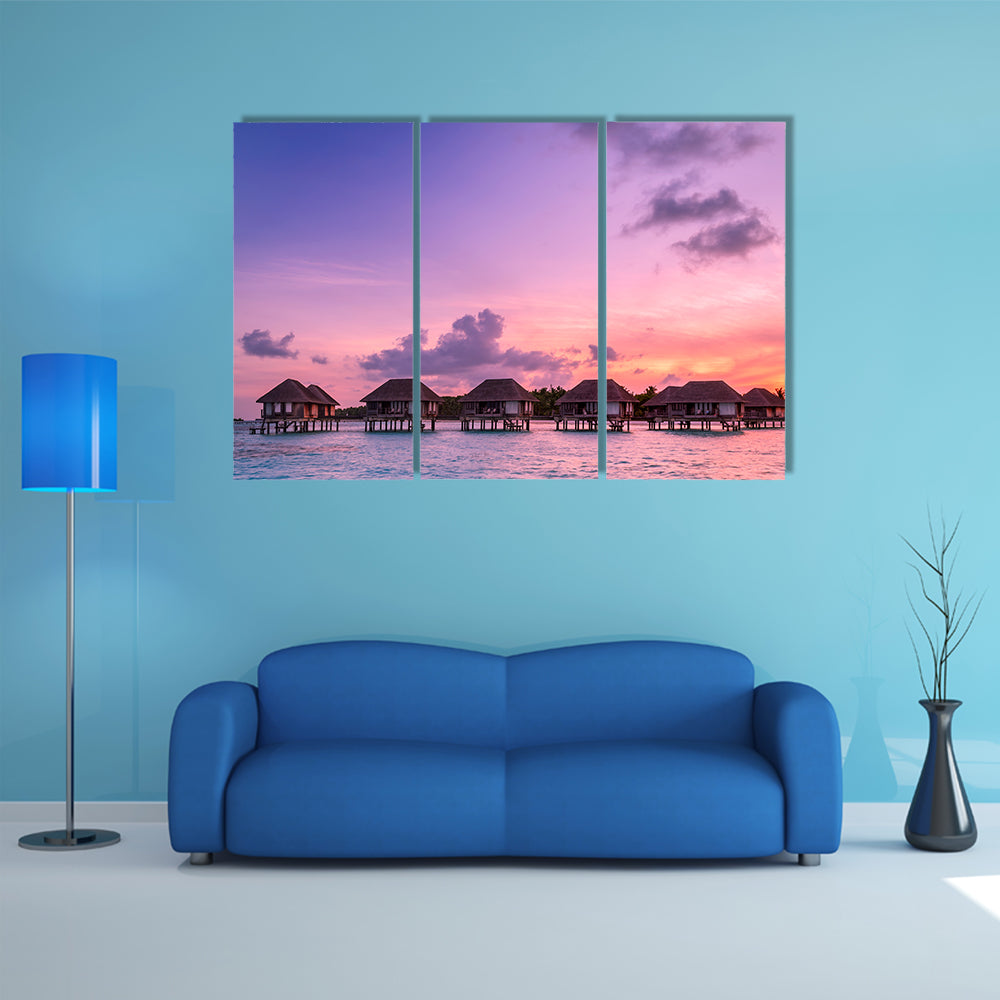 The Beauty Of the Sunrise Over Water Bungalows On A Cloudy day, Maldives Multi Panel Canvas Wall Art