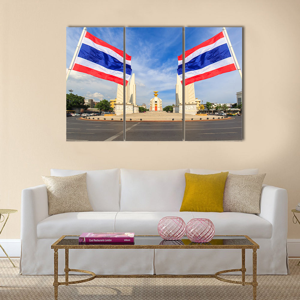 Democracy monument with blue sky and thai flag foreground in sunshine day, Bangkok, Thailand Multi panel canvas wall art