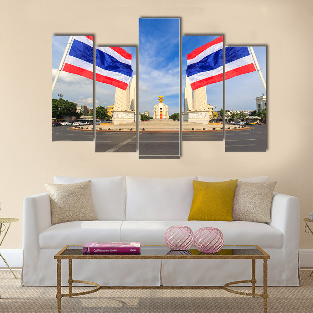 Democracy monument with blue sky and thai flag foreground in sunshine day, Bangkok, Thailand Multi panel canvas wall art