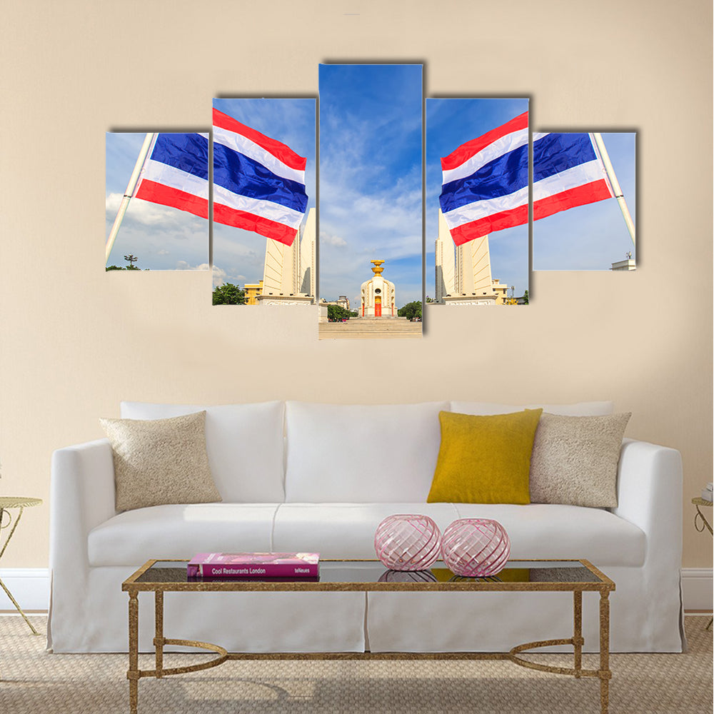 Democracy monument with blue sky and thai flag foreground in sunshine day, Bangkok, Thailand Multi panel canvas wall art