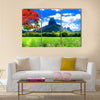 Beautiful mountain landscapes of Mauritius island with famous red tree Multi panel canvas wall art