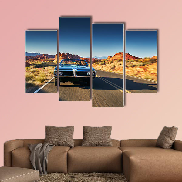 Man driving vintage car through desert multi panel canvas wall art