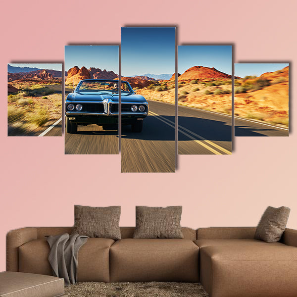 Man driving vintage car through desert multi panel canvas wall art