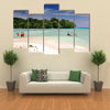 Vanuatu boys cross by foot and boat at low tide the channel over the sand bar Multi panel canvas wall art