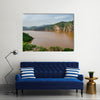 Landscape including calm brown water of Lake Ring Road Cameroon Multi panel canvas wall art