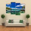 Natural infinity rock pool with palm trees over tropical ocean lagoon multi panel canvas wall art