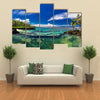 Natural infinity rock pool with palm trees over tropical ocean lagoon multi panel canvas wall art