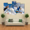 A volleyball player jumps to spike while another prepares to competition Multi panel canvas wall art