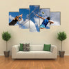 A volleyball player jumps to spike while another prepares to competition Multi panel canvas wall art