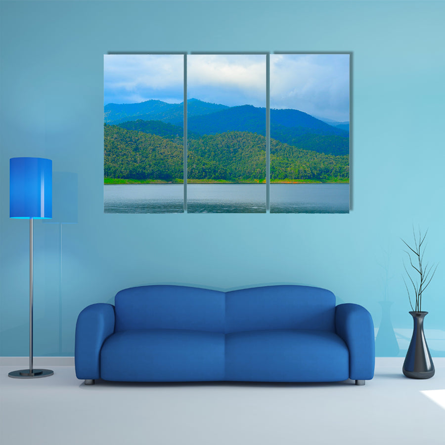 View of mountain forest landscape with heavy blue sky multi panel canvas wall art